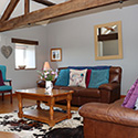 leather sofa with two armchairs at Beudy carrog